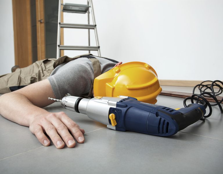 Manual worker is injured during drilling on the ladder